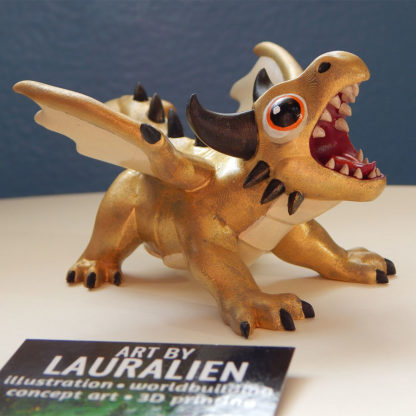 A small statue of a shiny gold dragon. The figurine is roaring, and has big cute eyes.